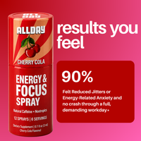 Red energy and focus spray can with cherry cola flavor on a pink background